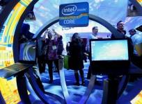a-woman-takes-a-photo-of-ultrabooks-at-the-intel-booth-during-the-2012-international-consumer-electronics-show-in-las-vegas