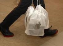 a-man-carries-packs-of-apple-iphone-4s-with-each-pack-containing-five-sets-outside-an-apple-store-in-hong-kong