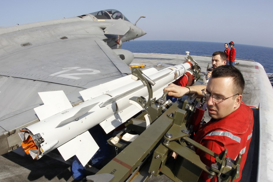 A Mica missile is installed on a Rafale fighter jet on the flight deck of France's flagship Charles de Gaulle aircraft carrier March 27, 2011. The Charles de Gaulle continued to run sorties against targets in Libya as France participates in the NATO no-fly zone. Rafale