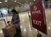a-lone-kingfisher-airlines-customer-waits-in-a-check-in-queue-at-mumbai039s-domestic-airport