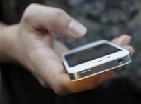 a-customer-uses-his-new-iphone-4s-after-making-the-purchase-at-apples-flagship-retail-store-in-san-francisco