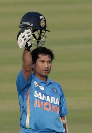 India's Sachin Tendulkar celebrates after he scored his 100th international century during their Asia Cup one- day international (ODI) cricket match against Bangladesh in Dhaka March 16, 2012.