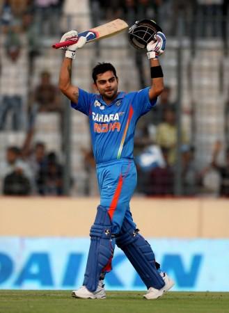 India's Virat Kohli celebrates after he scored a century against Sri Lanka in the second match of the Asia Cup one-day tournament cricket match in Dhaka March 13, 2012. Virat Kohli