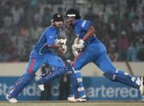 indias-dhoni-and-kohli-run-between-the-wickets-against-pakistan-during-their-asia-cup-one-day-international-cricket-match-in-dhaka