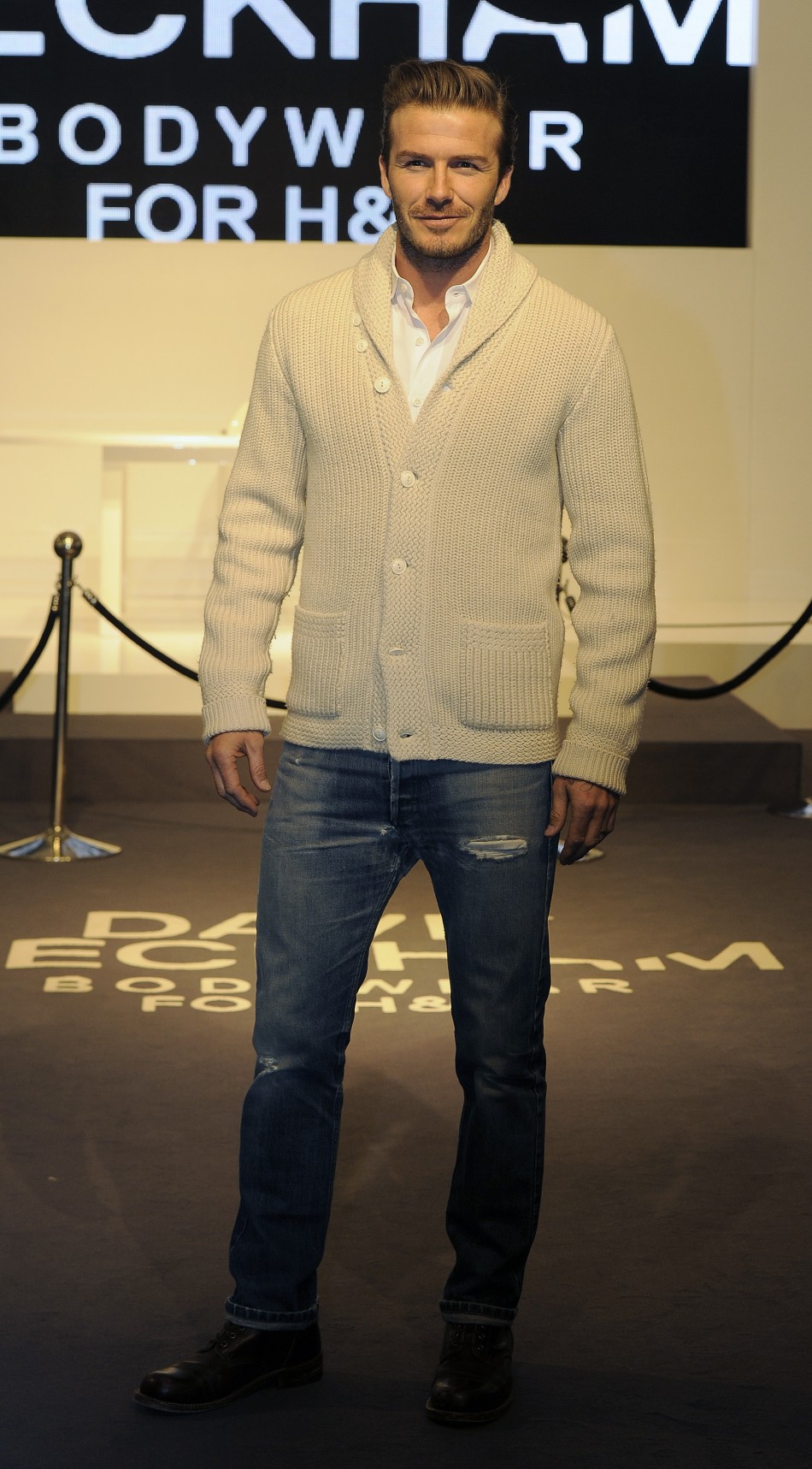 British soccer player David Beckham poses for photographers as he launches his Bodywear collection at a H&M store in central London February 1, 2012.
David Beckham