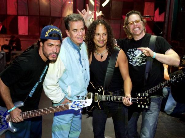 Metallica bassist Robert Trujillo, Dick Clark, Metallica guitarist Kirk Hammett and singer/guitarist James Hetfield, pose while the rock band rehearses for the 31st annual American Music Awards at the Shrine Auditorium in Los Angeles, California, November