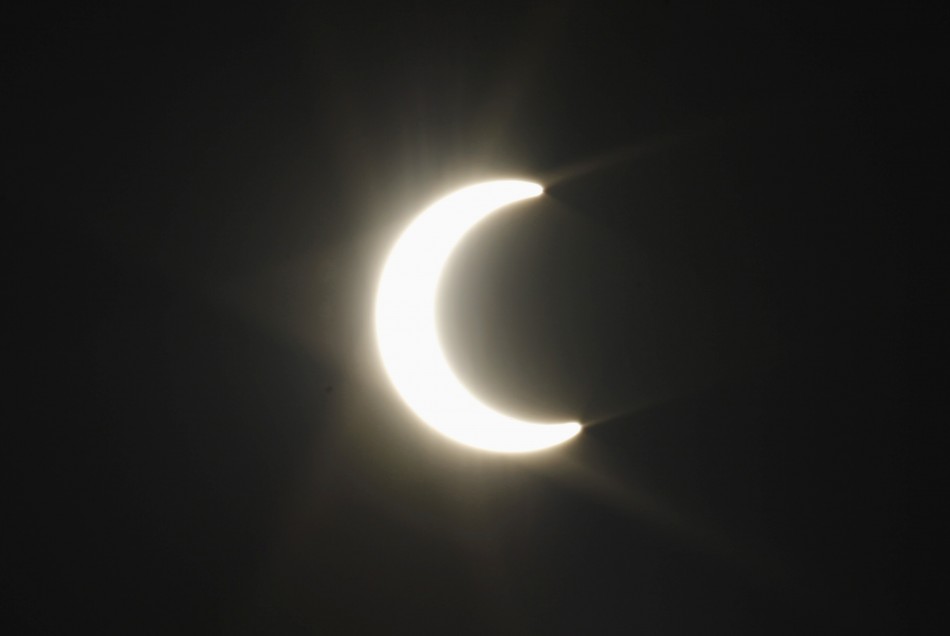 The moon passes between the sun and the earth during a solar eclipse seen from Pasadena Annual solar eclipse