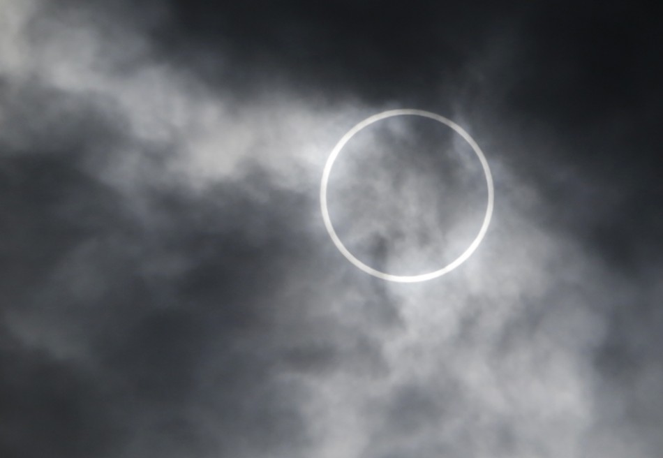 An annular solar eclipse is seen from a rooftop of the Roppongi Hills complex in Tokyo Annual solar eclipse