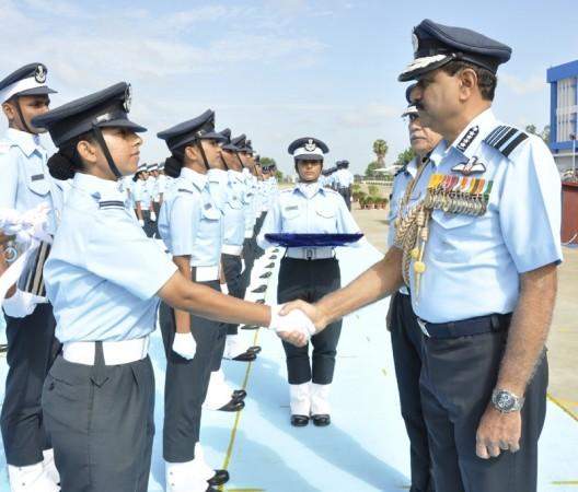 The Chief of Air Staff, Air Chief Marshal N.A.K. Browne congratulates the newly commissioned Flying Officers