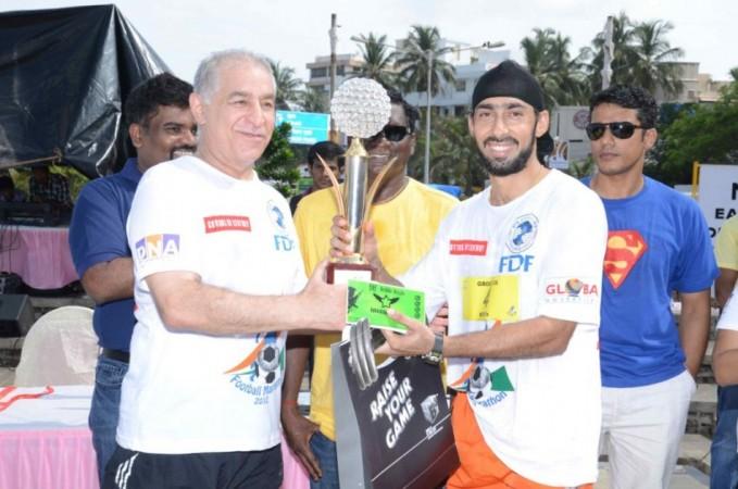 Dalip Tahil and Winner At the Football Marathon. Image: Scribes INC Dalip Tahil and Winner At the Football Marathon. Image: Scribes INC