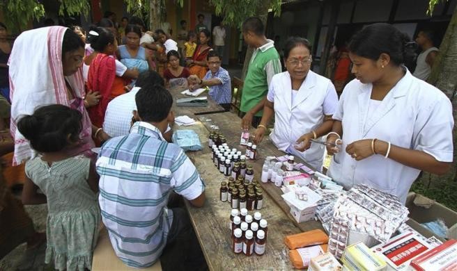 Villagers affected by the ethnic riots, crowd at a relief camp to receive medicines provided by the district administration near Kokrajhar town in Assam Assam Violence