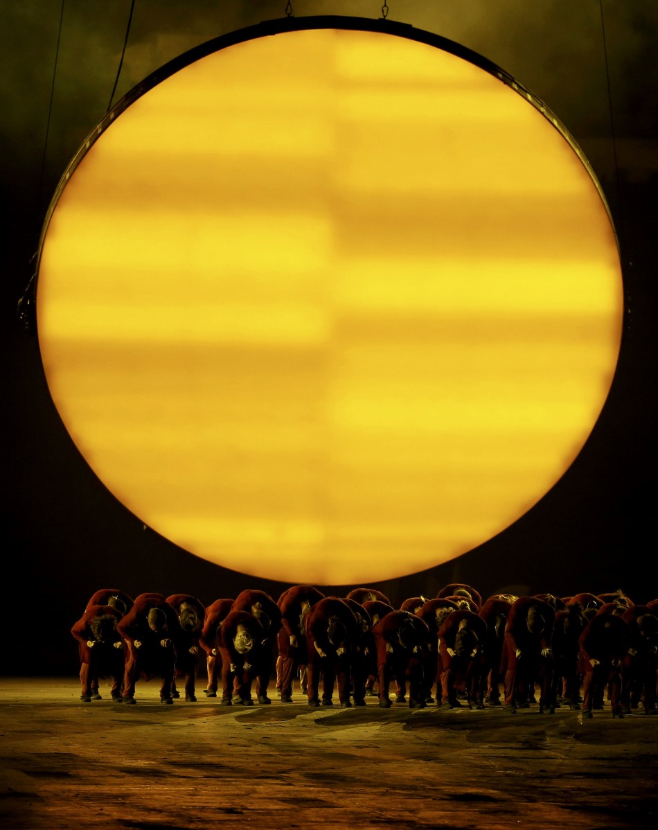 Performers take part in the opening ceremony of the London 2012 Olympic Games. London 2012 Olympic