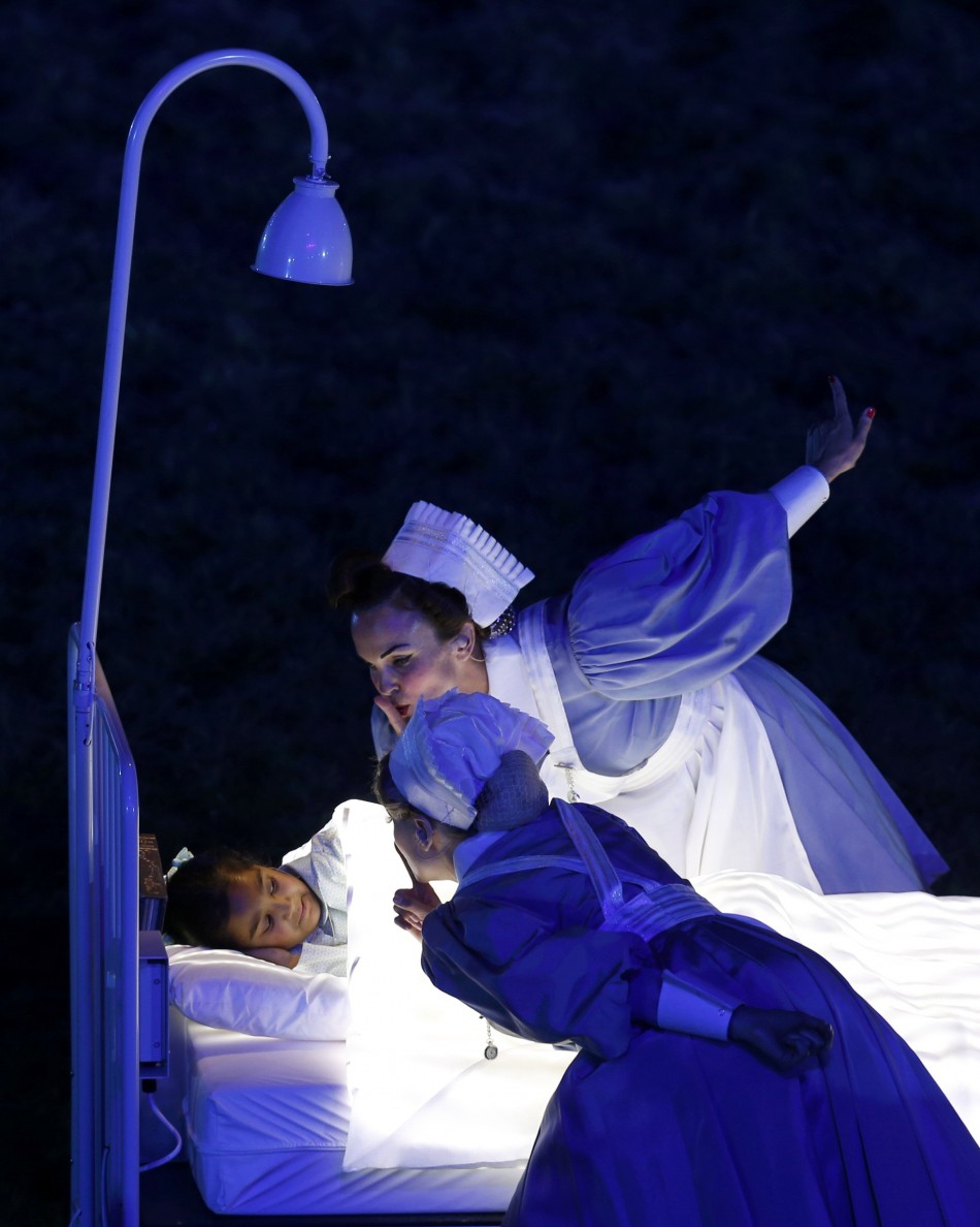 Performers take part in the opening ceremony of the London 2012 Olympic Games. London 2012 Olympic