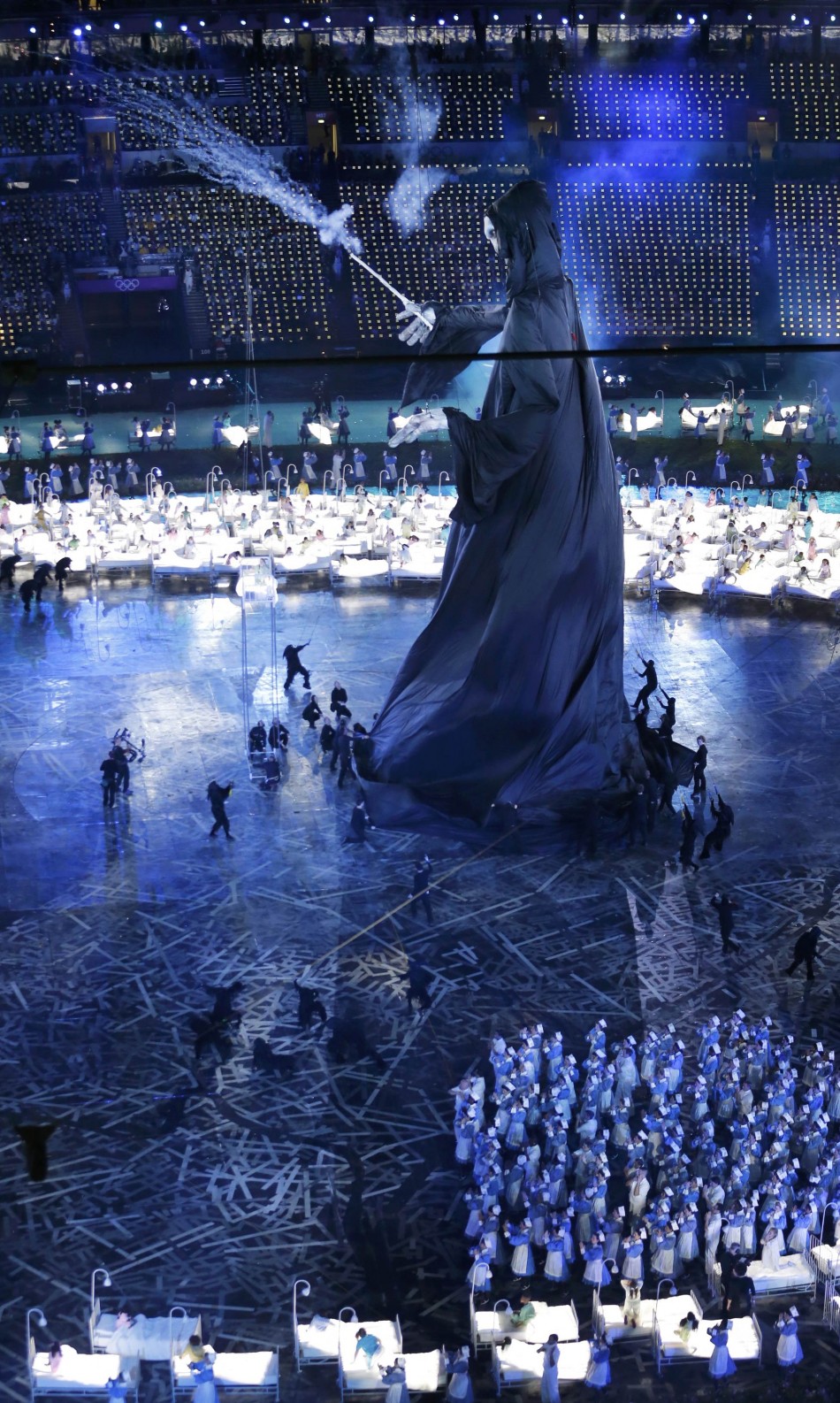 Performers take part in the opening ceremony of the London 2012 Olympic Games. London 2012 Olympic