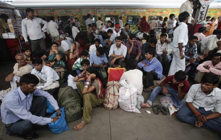 Passengers sit on a platform for their train to arrive as they wait for electricity to be restored at a railway station in New Delhi (Reuters) Blackouts in India