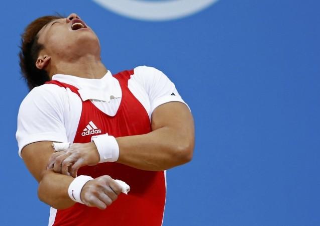 South Korea's Jaehyouk Sa shouts after getting injured on the men's 77Kg Group A weightlifting competition at the ExCel venue at the London 2012 Olympic Games. Source: Reuters South Korean Weightlifter Champion Sa Jae-hyouk Elbow Dislocated