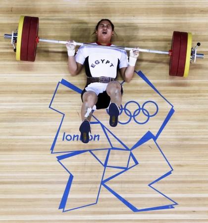 Egypt's Khalil K Abir Abdelrahman falls after failed attempt on the women's 75Kg group A weightlifting competition at the ExCel venue at the London 2012 Olympic Games August 3, 2012. REUTERS/Dominic Egypt's Khalil K Abir Abdelrahman