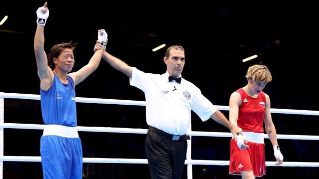 Mary Kom of India celebrates her victory Karolina Michalczuk of Poland during the Women's Fly (48-51kg) Boxing on Day 9.
