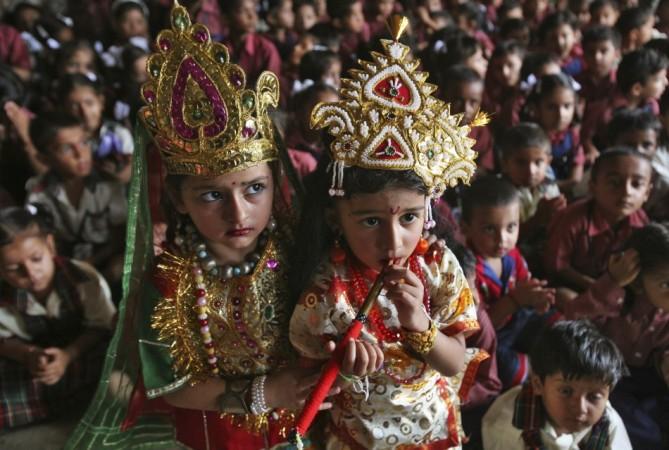School children dressed as Lord Krishna and Goddess Radha take part in celebrations on eve of Janmashtami in Jammu (Reuters) Janmashtami