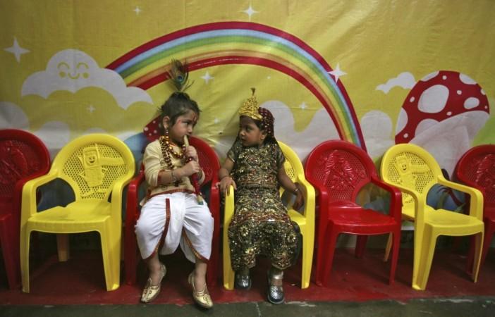 School children dressed as Lord Krishna and Goddess Radha take part in celebrations on eve of Janmashtami in Jammu (Reuters) Janmashtami