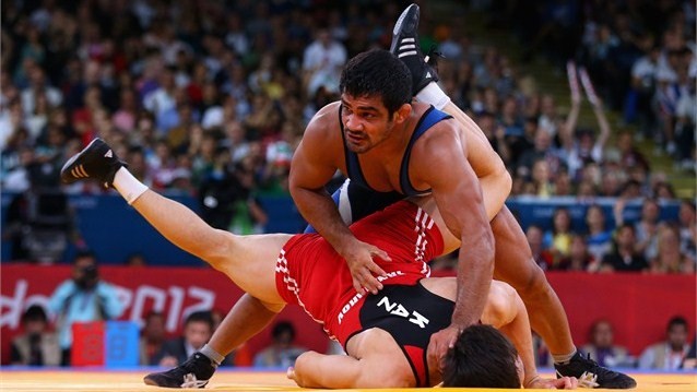 Sushil Kumar of India in action against Akzhurek Tanatarov of Kazakhstan