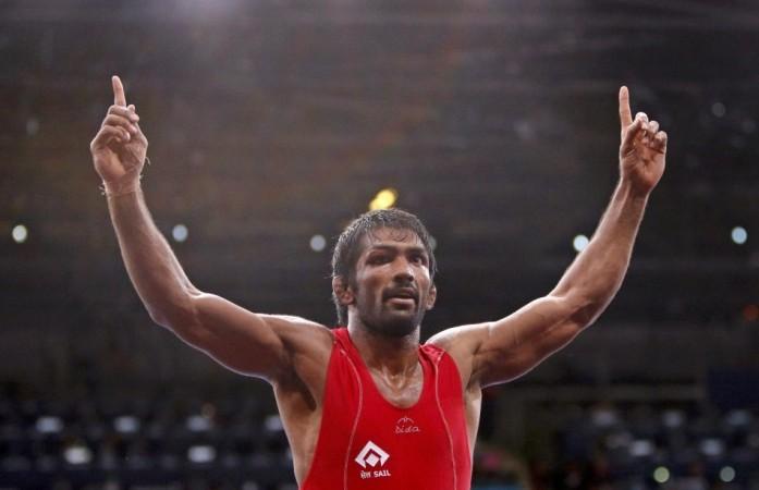 India's Yogeshwar Dutt celebrates his victory over North Korea's Jong Myong Ri for the gold medal on the Men's 60Kg Freestyle wrestling at the ExCel venue during the London 2012 Olympic Games India's Yogeshwar Dutt