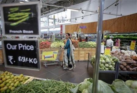 India allows FDI in retail, aviation sector Women shop at a retail supermarket in Mumbai