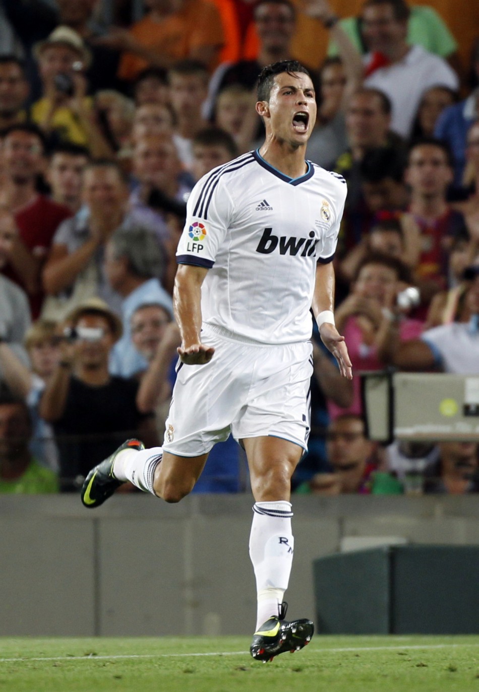 Real Madrid's Ronaldo celebrates after scoring a goal against Barcelona during their Spanish Super Cup first leg soccer match in Barcelona Ronaldo