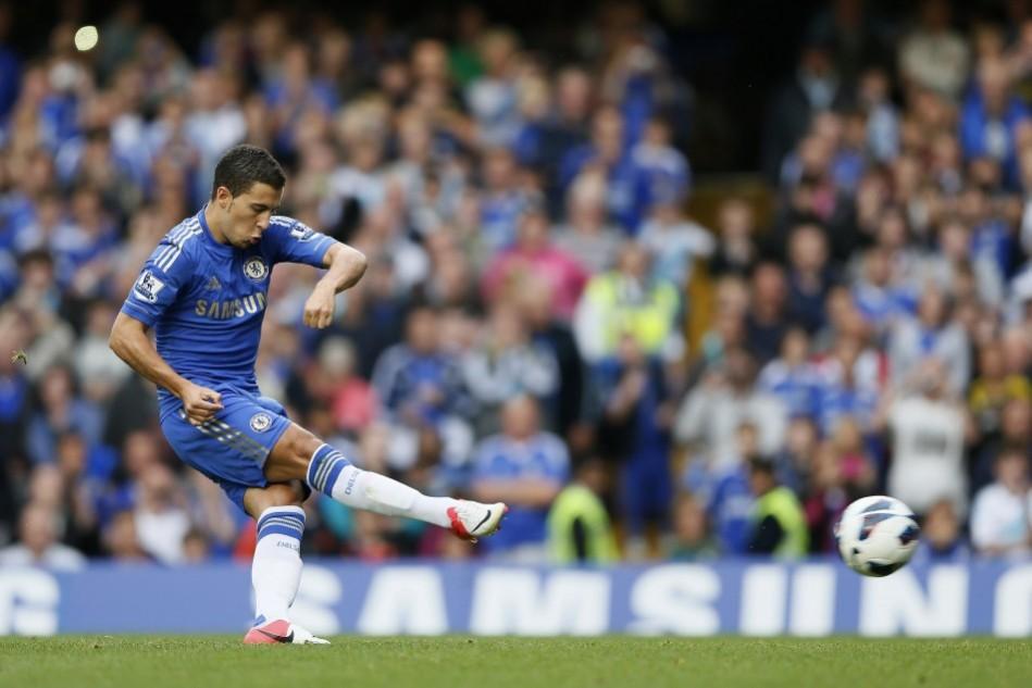 Chelsea's Eden Hazard scores with a penalty against Newcastle United during their English Premier League soccer match at Stamford Bridge in London Eden Hazard