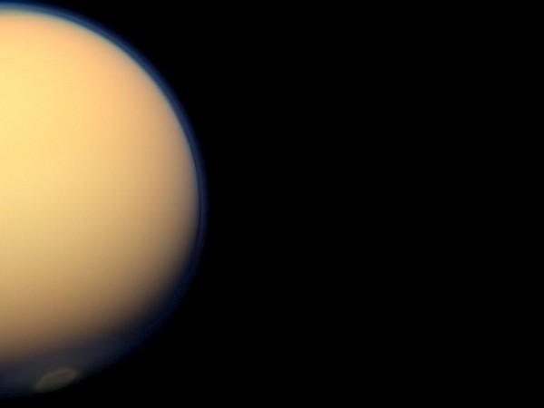 The recently formed south polar vortex stands out in the color-swaddled atmosphere of Saturn's largest moon, Titan, in this natural color view from NASA's Cassini spacecraft. Source: NASA/JPL-Caltech/SSI Saturn and Titan