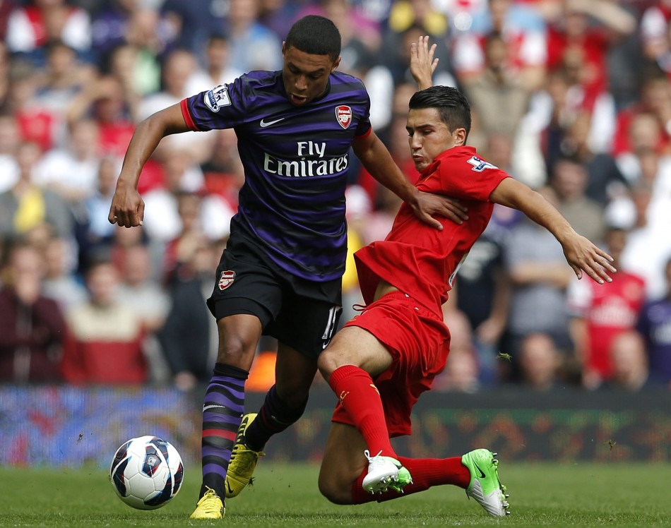 Liverpool's Sahin challenges Arsenal's Oxlade-Chamberlain during their English Premier League soccer match at Anfield in Liverpool Arsenal, Liverpool