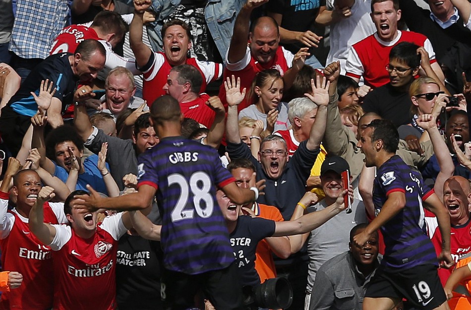 Arsenal's Cazorla celebrates his goal against Liverpool during their English Premier League soccer match at Anfield in Liverpool Arsenal