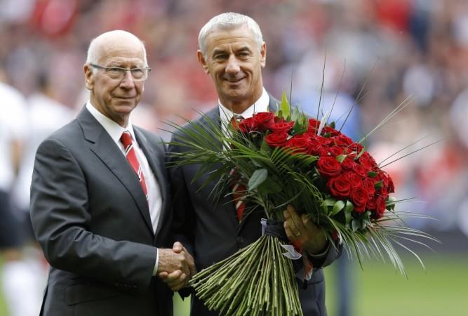 Charlton and Rush pose with 96 red roses in memory of the Hillsborough disaster at Anfield in Liverpool Sir Bobby Charlton, Ian Rush