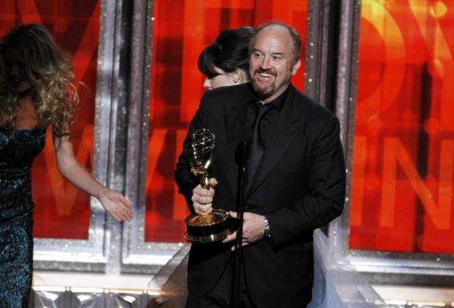 Louis C.K. smiles as he accepts the award for outstanding writing in a comedy series at the 64th Primetime Emmy Awards in Los Angeles Louis C.K.