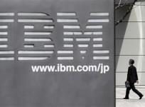 a-man-walks-past-the-headquarters-of-ibm-japan-in-tokyo