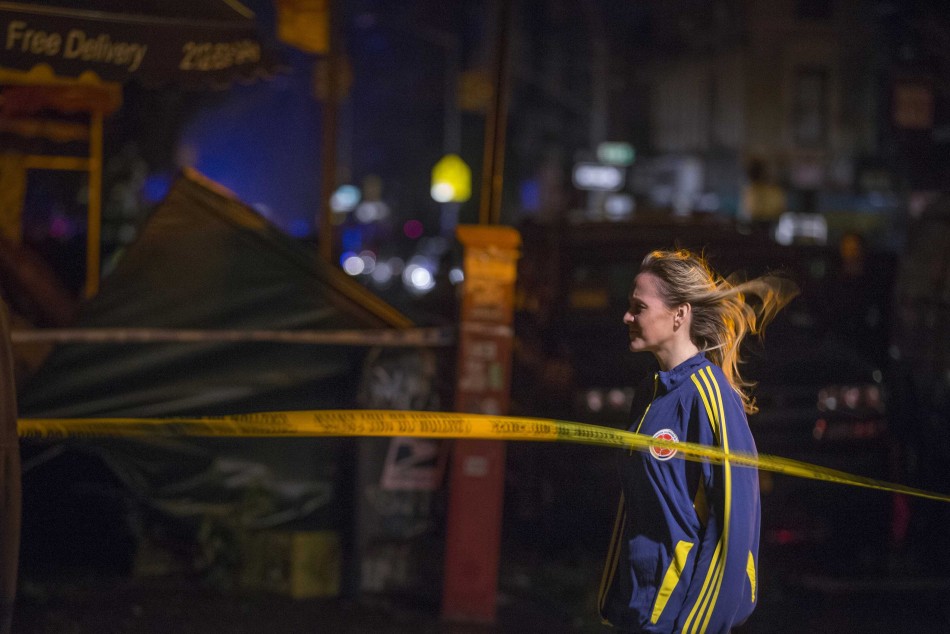 A resident looks at destruction left by Hurricane Sandy during a power outage in Lower Manhattan Hurricane Sandy