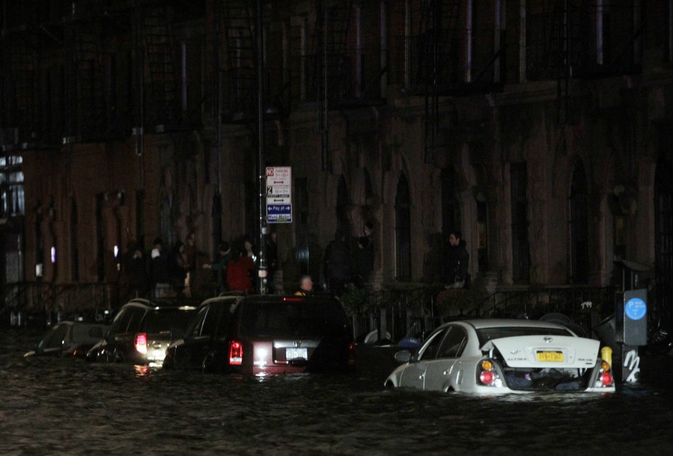 Flood waters brought on by Hurricane Sandy over run a car in New York's lower east side Hurricane Sandy