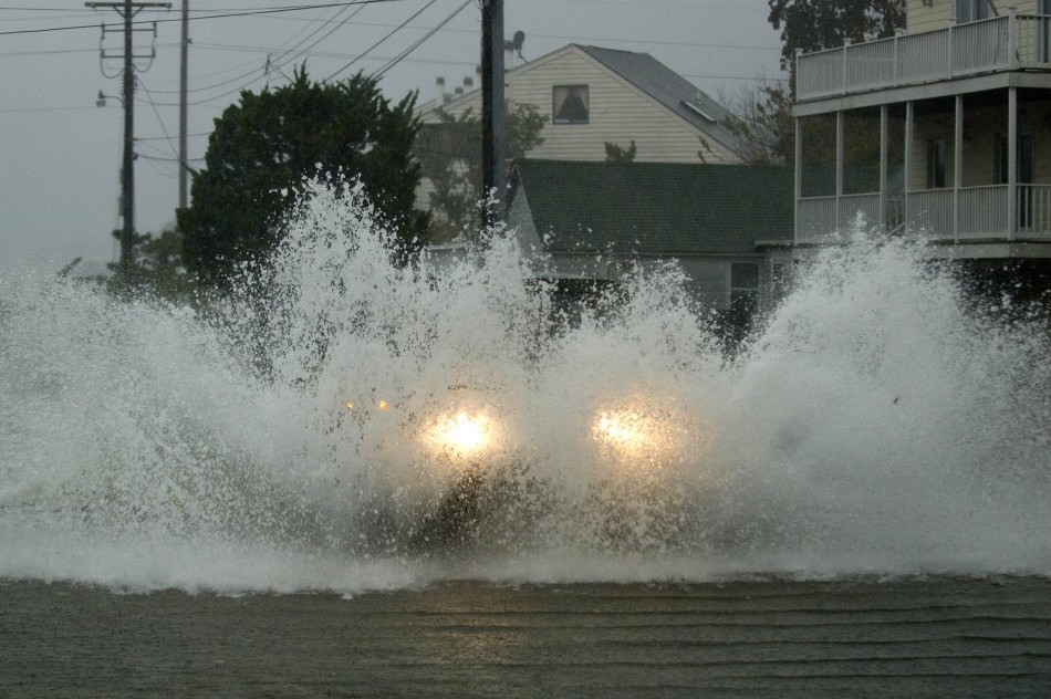 An emergency vehicle plows through flood water as Hurricane Sandy comes ashore in Dewey Beach Hurricane Sandy