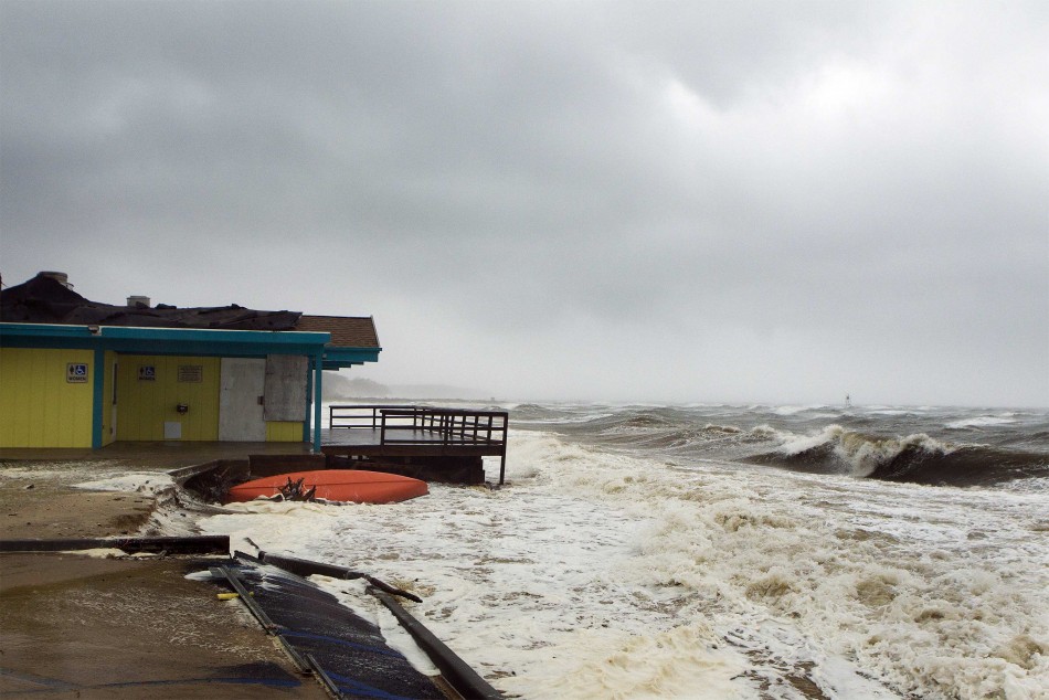The storm surge from Hurricane Sandy beats against a beachside building in Shinnecock Hills, New York Hurricane Sandy