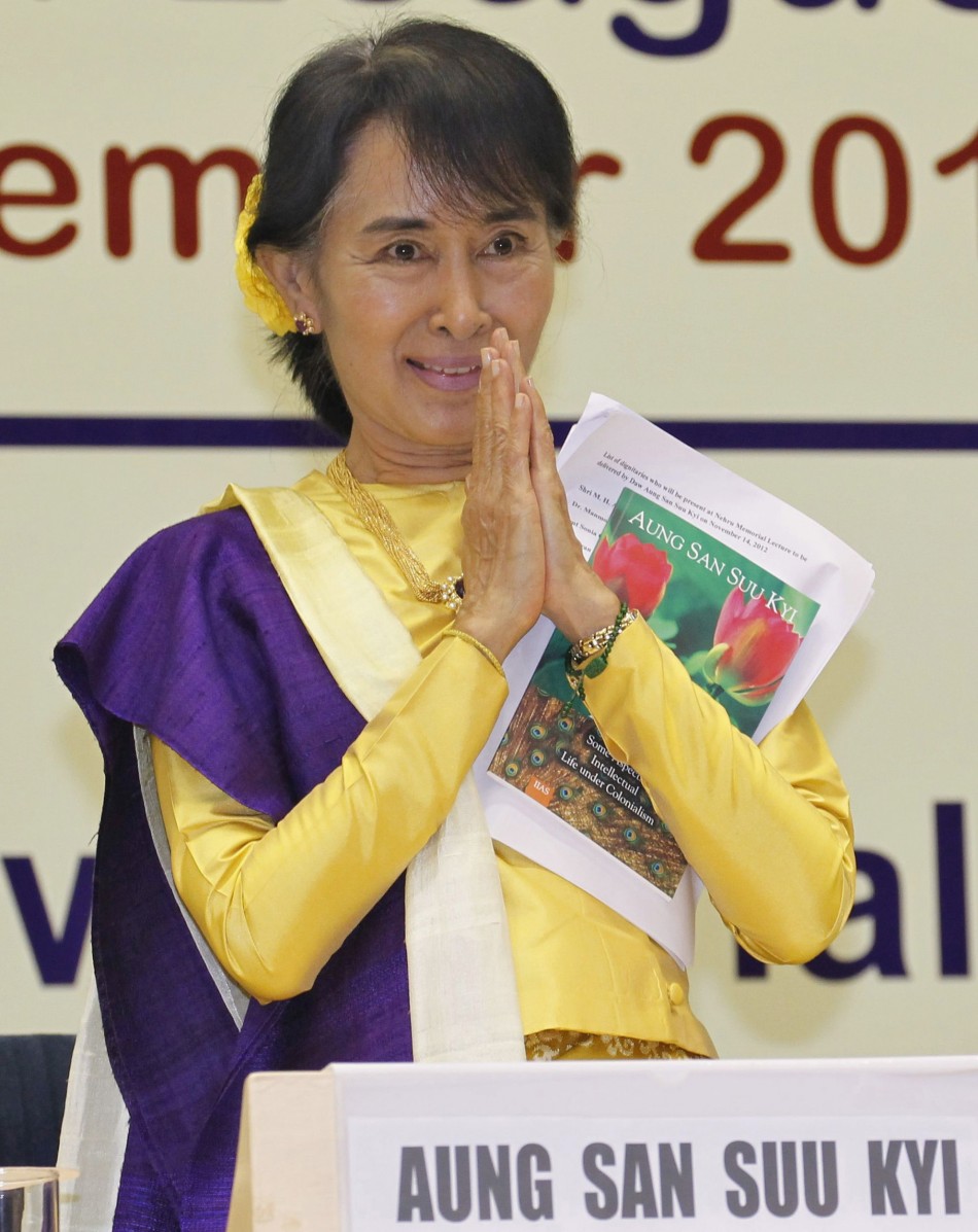 Myanmar's opposition leader Aung San Suu Kyi gestures during the Nehru memorial lecture in New Delhi. Aung San Suu Kyi Takes A Walk Down Memory Lane, Feels Herself ‘Partly A Citizen Of India’ (PHOTOS)