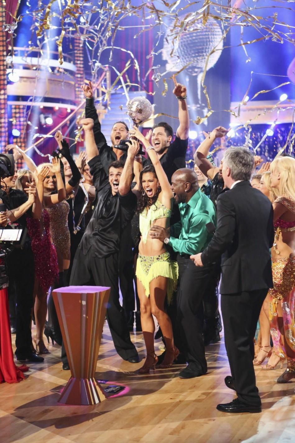 Publicity photograph showing contestants Rycroft and Dovolani holding the mirror ball trophy as they are crowned champions on the season finale of ABC's Melissa Rycroft, Tony Dovolani