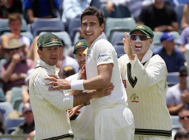 Australia's Ponting and Hussey congratulate team mate Starc for bowling out South Africa's Petersen during the first day's play of the third cricket test match, at the WACA in Perth Ricky Ponting