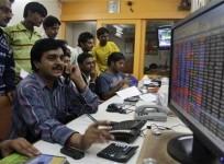 a-trader-works-at-a-stock-brokerage-in-ahmedabad-november-26-2010