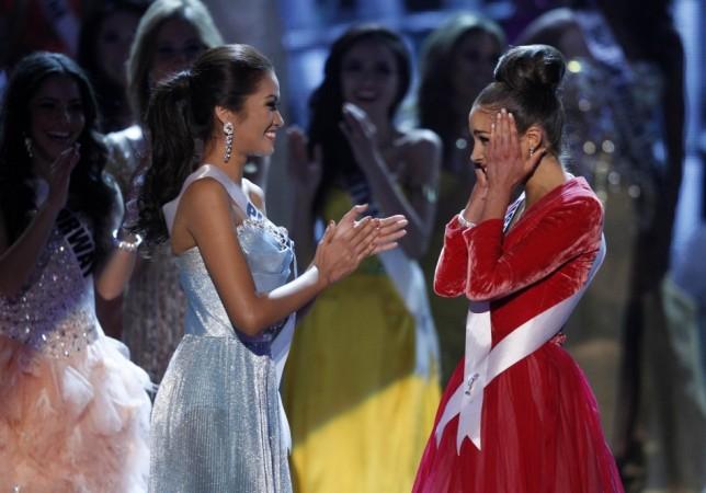 Miss USA Olivia Culpo reacts with Miss Philippines Janine Tugonon after winning Miss Universe pageant in Las Vegas Miss Universe 2012