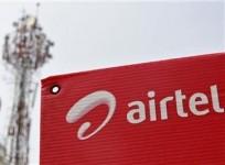 a-bharti-airtel-advertisement-board-is-installed-against-the-backdrop-of-companys-telecommunication-tower-in-kochi-november-30-2012