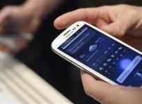 a-man-uses-samsung-electronics039-new-samsung-galaxy-siii-smartphone-during-its-launch-at-the-earls-court-exhibition-centre-in-london