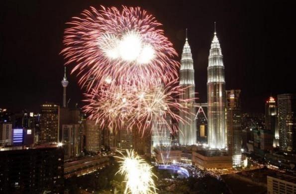 Fireworks explode near the Malaysia's landmark Petronas Twin Towers during New Year celebrations in Kuala Lumpur Fireworks explode near the Malaysia's landmark Petronas Twin Towers during New Year celebrations in Kuala Lumpur
