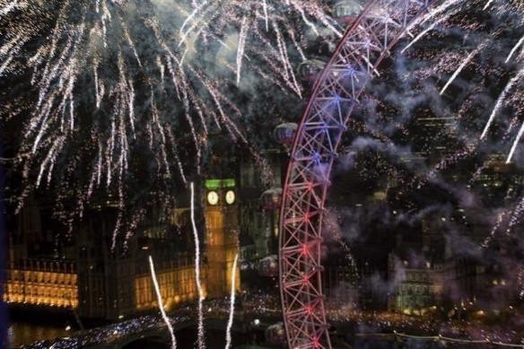 Fireworks explode across the skyline near the London Eye during New Year celebrations in London Fireworks explode across the skyline near the London Eye during New Year celebrations in London