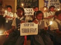 students-hold-candles-as-they-pray-during-a-candlelight-vigil-for-a-gang-rape-victim-who-was-assaulted-in-new-delhi-in-ahmedabad-december-31-2012