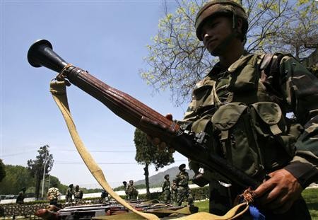An Indian army soldier displays a seized rocket propelled grenades launcher (RPGL) during a news conference inside a military garrison in Srinagar April 25, 2009.